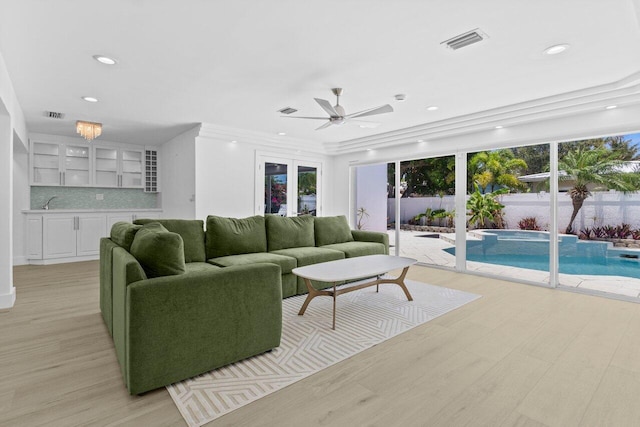 2611 NE 49th St, Lighthouse Point, FL 33064 - living room with light wood-style flooring, ceiling fan, and recessed lighting