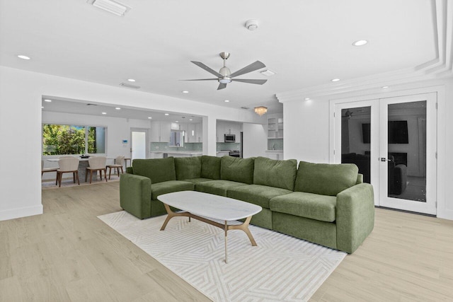 2611 NE 49th St, Lighthouse Point, FL 33064 - living area with a ceiling fan, recessed lighting, and light wood-style floors