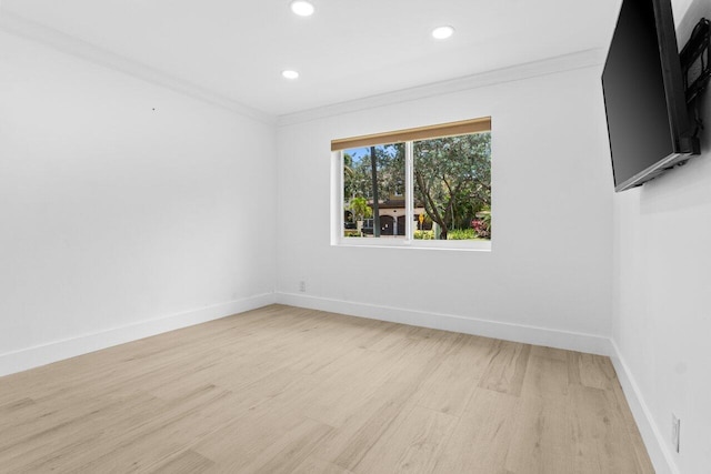 2611 NE 49th St, Lighthouse Point, FL 33064 - spare room with light wood-type flooring, ornamental molding, baseboards, and recessed lighting