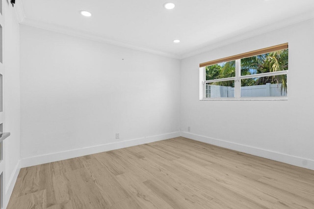 2611 NE 49th St, Lighthouse Point, FL 33064 - empty room featuring ornamental molding, light wood finished floors, baseboards, and recessed lighting
