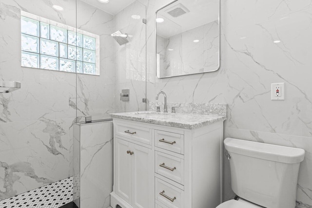 2611 NE 49th St, Lighthouse Point, FL 33064 - full bath featuring tile walls, vanity, a marble finish shower, and toilet