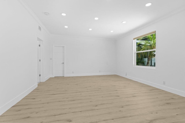 2611 NE 49th St, Lighthouse Point, FL 33064 - spare room with ornamental molding, recessed lighting, light wood-type flooring, baseboards, and a smoke detector