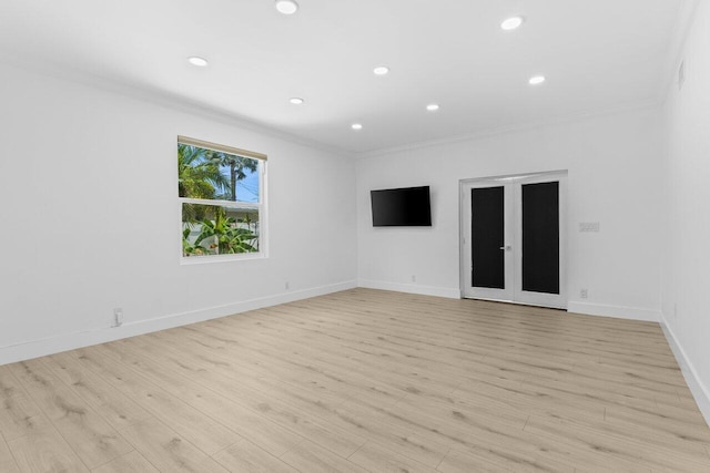 2611 NE 49th St, Lighthouse Point, FL 33064 - spare room with crown molding, recessed lighting, light wood-type flooring, and baseboards