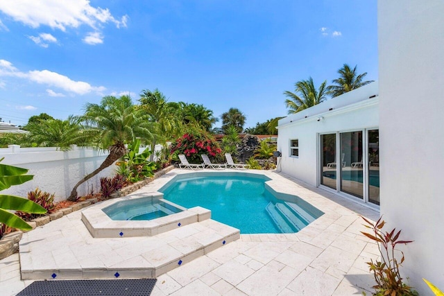 2611 NE 49th St, Lighthouse Point, FL 33064 - view of pool with a patio, a fenced backyard, and a pool with connected hot tub