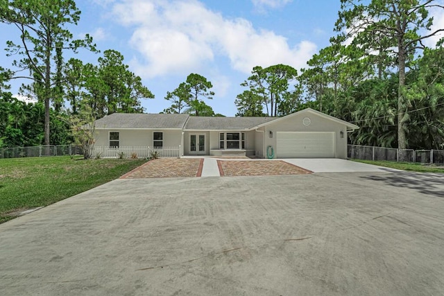 11849 59th St N, Royal Palm Beach, FL 33411 - ranch-style home featuring an attached garage, driveway, french doors, and stucco siding