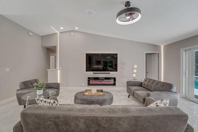 11849 59th St N, Royal Palm Beach, FL 33411 - living room with vaulted ceiling, baseboards, and a glass covered fireplace