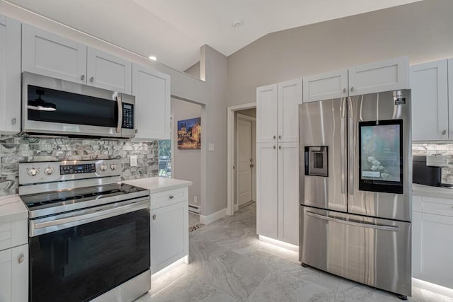 11849 59th St N, Royal Palm Beach, FL 33411 - kitchen with stainless steel appliances, vaulted ceiling, light countertops, decorative backsplash, and light marble finish floors