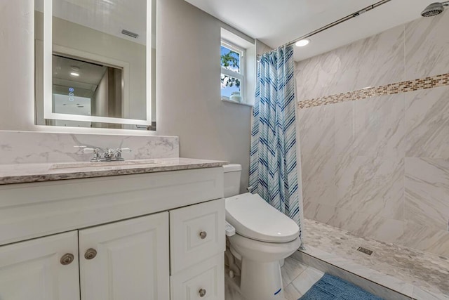 11849 59th St N, Royal Palm Beach, FL 33411 - bathroom with a tile shower, vanity, and toilet