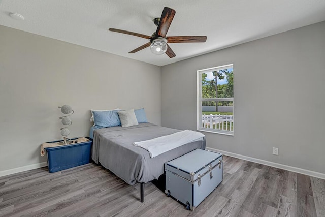 11849 59th St N, Royal Palm Beach, FL 33411 - bedroom with wood finished floors, a ceiling fan, and baseboards