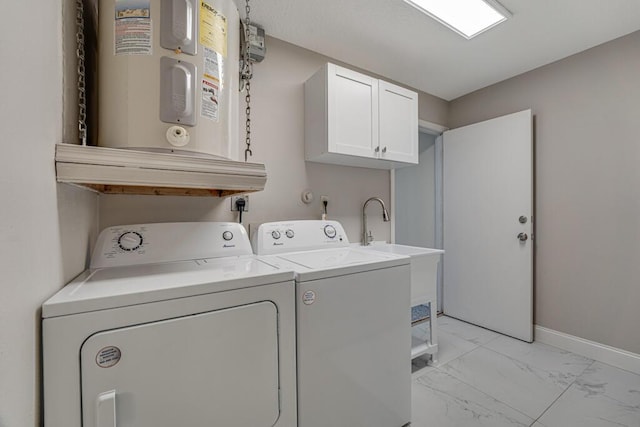 11849 59th St N, Royal Palm Beach, FL 33411 - laundry area featuring electric water heater, cabinet space, washer and clothes dryer, light marble finish flooring, and baseboards