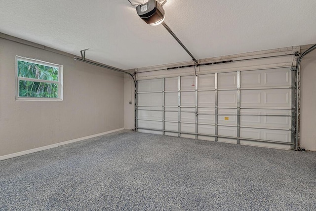 11849 59th St N, Royal Palm Beach, FL 33411 - garage featuring a garage door opener and baseboards
