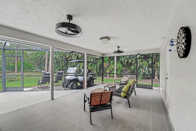 11849 59th St N, Royal Palm Beach, FL 33411 - sunroom / solarium featuring plenty of natural light, a ceiling fan, and an outdoor living space