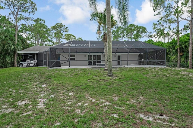 11849 59th St N, Royal Palm Beach, FL 33411 - rear view of house featuring a lawn and a lanai