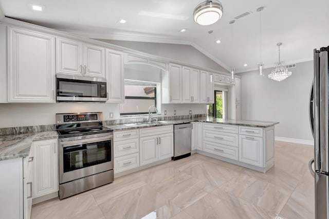 3 Independence Ct, Deerfield Beach, FL 33442 - kitchen featuring appliances with stainless steel finishes, a peninsula, vaulted ceiling, white cabinetry, and crown molding