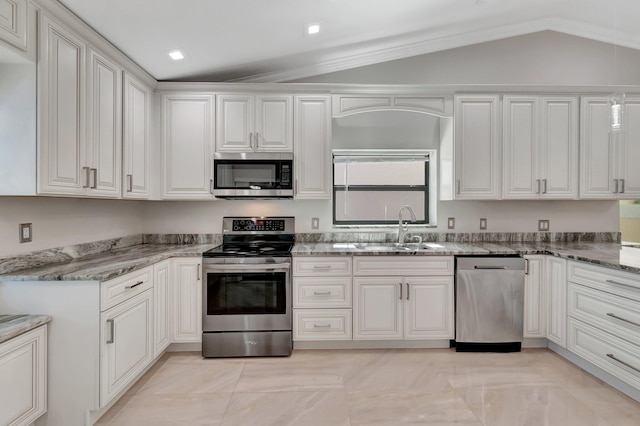 3 Independence Ct, Deerfield Beach, FL 33442 - kitchen featuring appliances with stainless steel finishes, a sink, lofted ceiling, white cabinets, and light stone counters