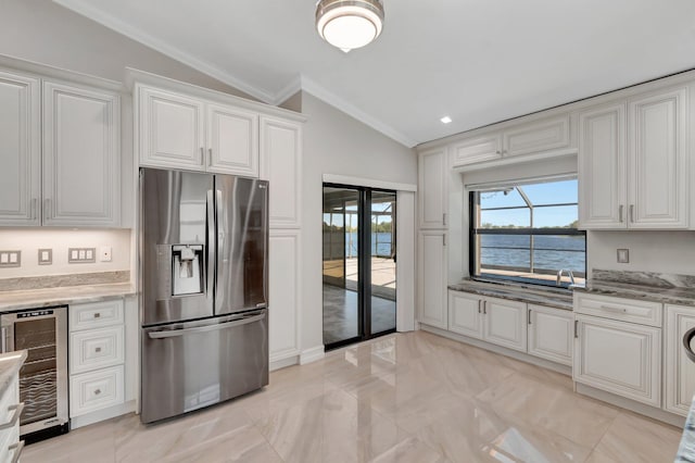 3 Independence Ct, Deerfield Beach, FL 33442 - kitchen featuring stainless steel refrigerator with ice dispenser, vaulted ceiling, wine cooler, crown molding, and light marble finish floors
