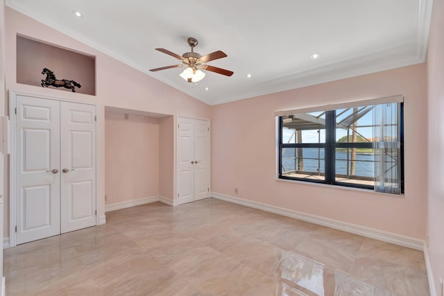 3 Independence Ct, Deerfield Beach, FL 33442 - unfurnished bedroom with lofted ceiling, multiple closets, crown molding, baseboards, and a water view