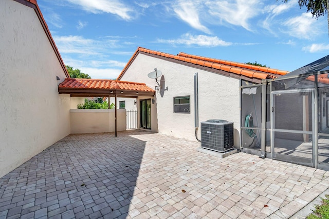 3 Independence Ct, Deerfield Beach, FL 33442 - view of patio with central AC unit and a gate