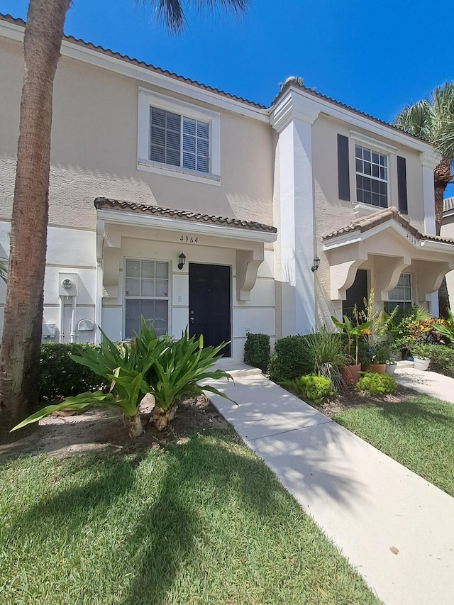 4964 Palmbrooke Cir, West Palm Beach, FL 33417 - view of front of property featuring stucco siding and a tile roof