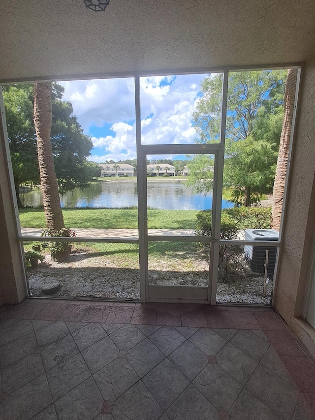 4964 Palmbrooke Cir, West Palm Beach, FL 33417 - unfurnished sunroom with a water view