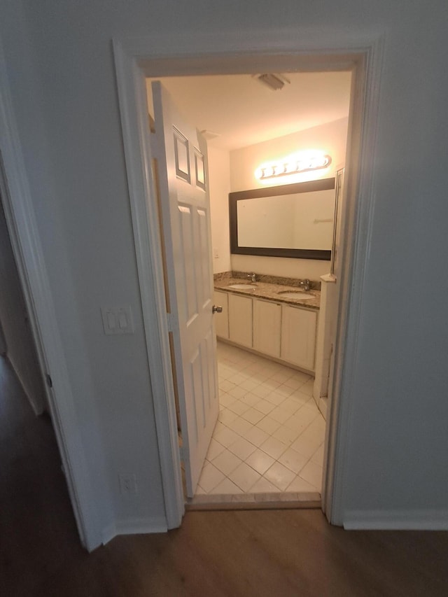 4964 Palmbrooke Cir, West Palm Beach, FL 33417 - hallway with a sink and light tile patterned floors