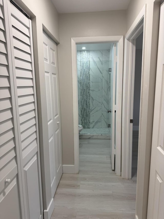 14814 Wildflower Ln, Delray Beach, FL 33446 - hall with light wood-style floors and baseboards
