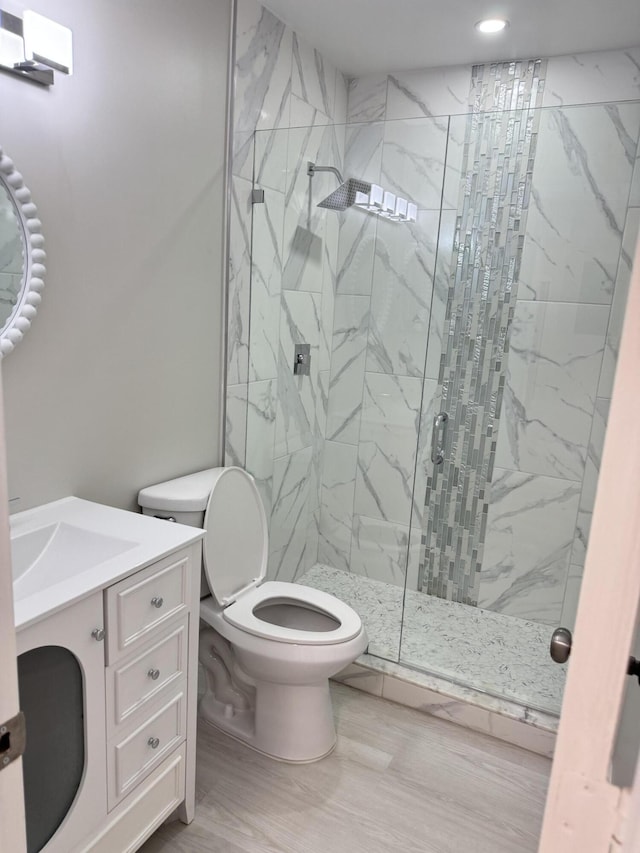 14814 Wildflower Ln, Delray Beach, FL 33446 - full bath with a marble finish shower, toilet, vanity, recessed lighting, and wood finished floors