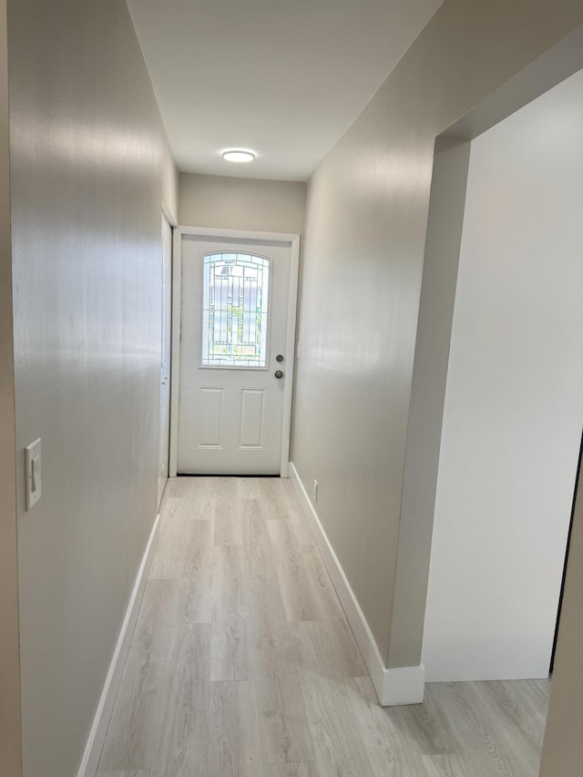14814 Wildflower Ln, Delray Beach, FL 33446 - doorway with light wood finished floors and baseboards