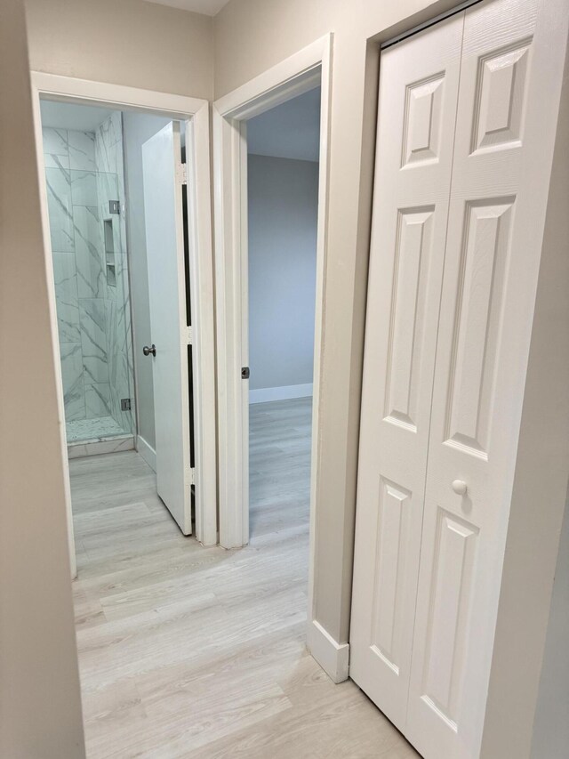 14814 Wildflower Ln, Delray Beach, FL 33446 - hall featuring baseboards and light wood finished floors