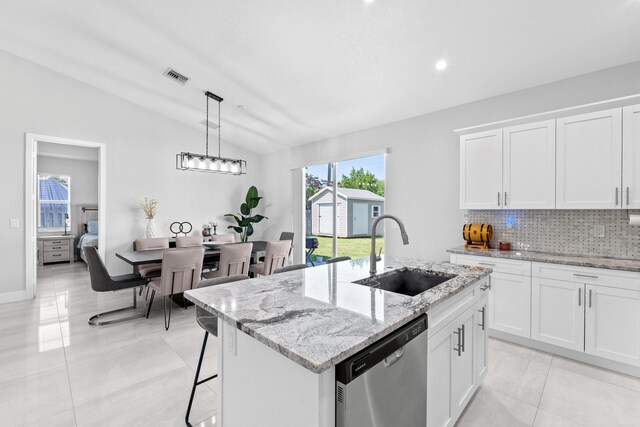 12111 Sugar Pine Trl, Wellington, FL 33414 - kitchen with dishwasher, lofted ceiling, a sink, decorative backsplash, and healthy amount of natural light