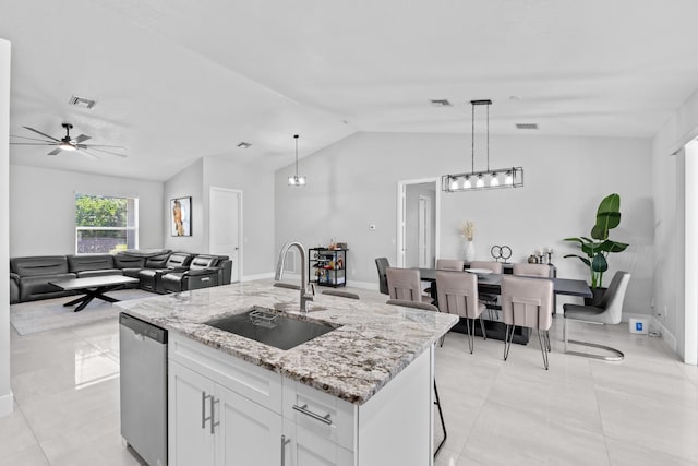 12111 Sugar Pine Trl, Wellington, FL 33414 - kitchen with a sink, lofted ceiling, dishwasher, white cabinets, and light stone counters
