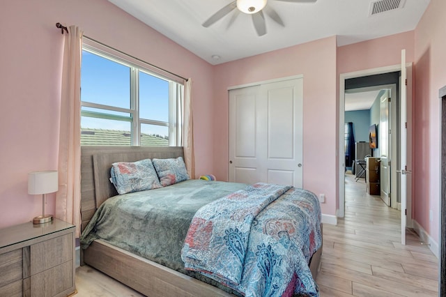 5968 Jasmine Ln, Westlake, FL 33470 - bedroom featuring baseboards, light wood-type flooring, a closet, and a ceiling fan