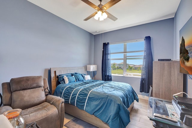 5968 Jasmine Ln, Westlake, FL 33470 - bedroom with light wood finished floors, ceiling fan, and baseboards