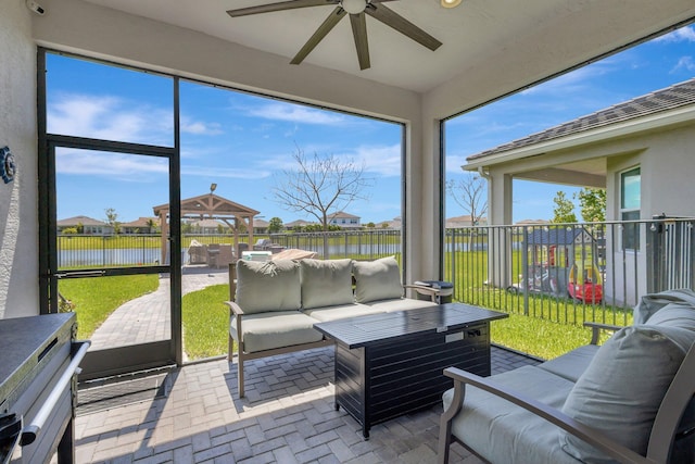 5968 Jasmine Ln, Westlake, FL 33470 - sunroom / solarium with an outdoor living space, a water view, ceiling fan, and plenty of natural light