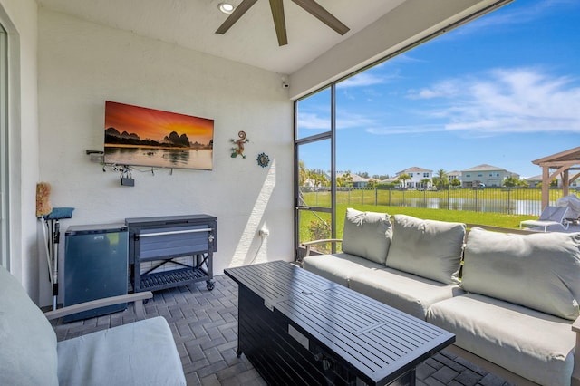 5968 Jasmine Ln, Westlake, FL 33470 - sunroom with outdoor lounge area, a ceiling fan, and a residential view