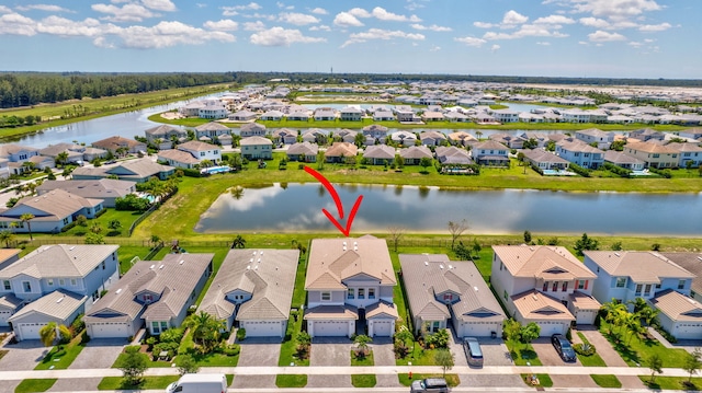 5968 Jasmine Ln, Westlake, FL 33470 - aerial perspective of suburban area with a nearby body of water