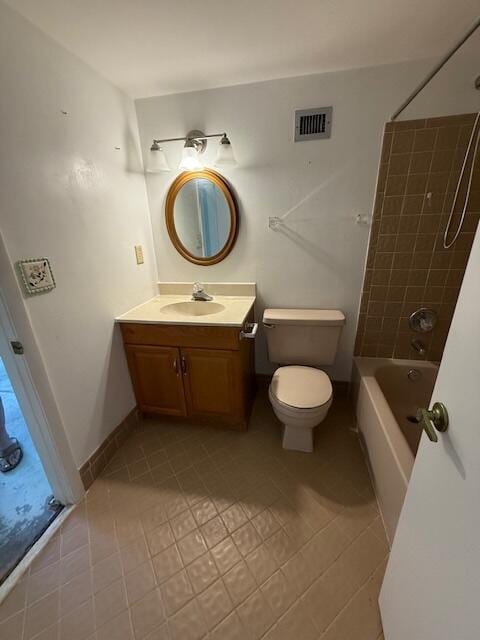 bathroom featuring vanity, toilet, tub / shower combination, and tile patterned floors