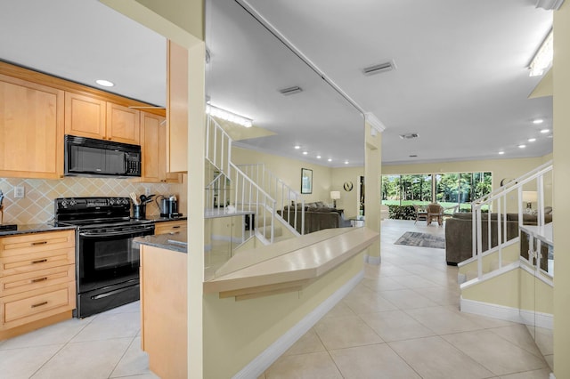 kitchen featuring black appliances, light tile patterned floors, backsplash, open floor plan, and baseboards