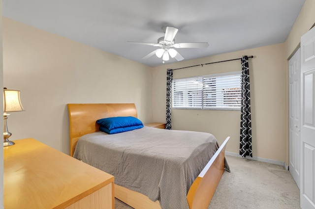 bedroom featuring carpet, a ceiling fan, and baseboards