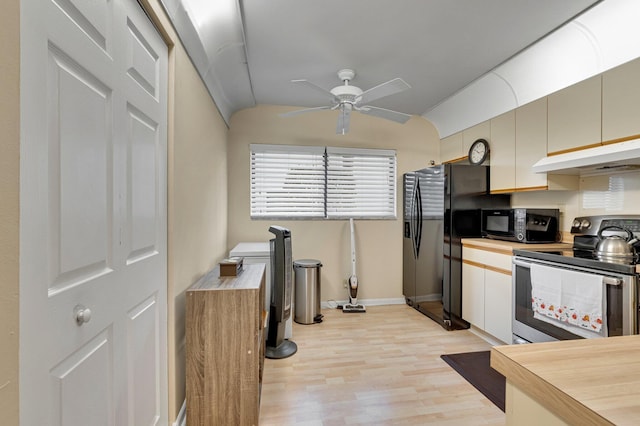 kitchen featuring black appliances, under cabinet range hood, ceiling fan, light wood finished floors, and vaulted ceiling