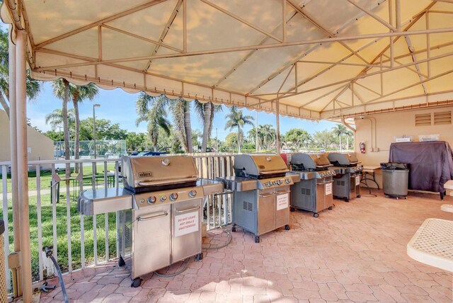 view of patio featuring area for grilling and fence