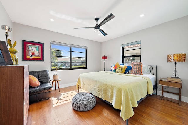 1613 N J Ter, Lake Worth Beach, FL 33460 - bedroom with multiple windows, hardwood / wood-style flooring, baseboards, and recessed lighting