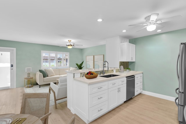 79 Saxony B B, Delray Beach, FL 33446 - kitchen featuring a sink, appliances with stainless steel finishes, ceiling fan, white cabinets, and recessed lighting