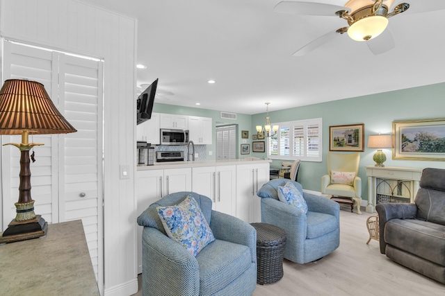 79 Saxony B B, Delray Beach, FL 33446 - living area featuring a chandelier, light wood-style floors, baseboards, ceiling fan, and recessed lighting