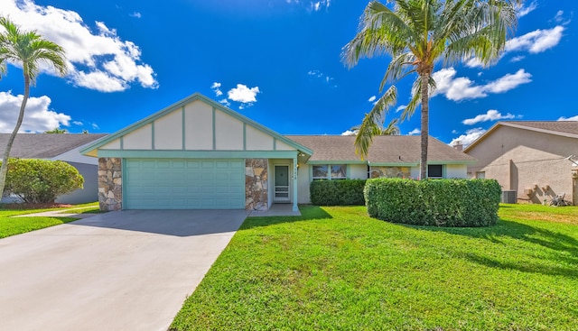 10687 Katmandu Ct, Boynton Beach, FL 33437 - view of front of home featuring an attached garage, board and batten siding, concrete driveway, a front lawn, and central AC unit