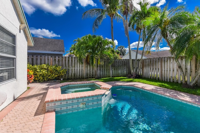 10687 Katmandu Ct, Boynton Beach, FL 33437 - view of swimming pool with a fenced backyard and a pool with connected hot tub