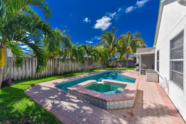 10687 Katmandu Ct, Boynton Beach, FL 33437 - view of pool featuring an in-ground hot tub, a fenced backyard, a patio area, and area for grilling