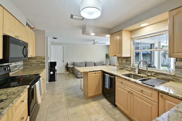 10687 Katmandu Ct, Boynton Beach, FL 33437 - kitchen featuring black appliances, light brown cabinetry, open floor plan, and recessed lighting