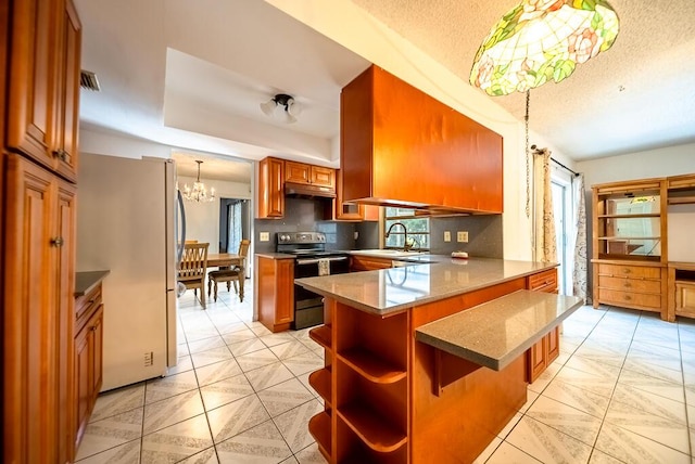 4424 Regency Dr, Lake Worth, FL 33461 - kitchen featuring electric range, freestanding refrigerator, a chandelier, open shelves, and a peninsula