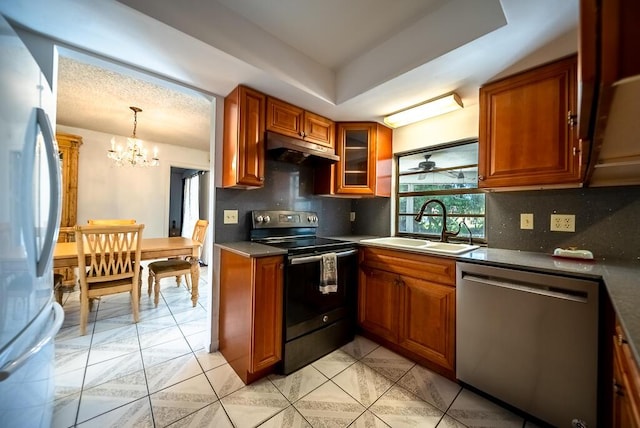 4424 Regency Dr, Lake Worth, FL 33461 - kitchen featuring dishwasher, electric stove, freestanding refrigerator, under cabinet range hood, and a sink